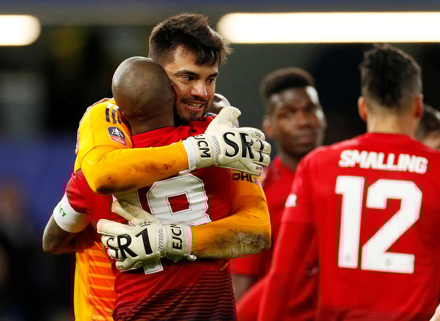 - Chelsea v Manchester United - Stamford Bridge, London, Britain - February 18, 2019 Manchester United's Sergio Romero celebrates with Ashley Young after the match Action Images via Reuters
