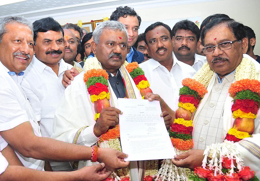 Yeshwantpur MLA, S T Somashekar, after taking office as BDA chairman on Thursday. Deputy Chief Minister G Parameshwara is also seen.