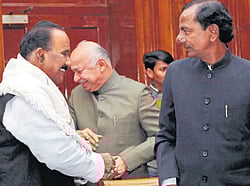Union Home Minister Sushil Kumar Shinde (centre) and TRS President K Chandrashekhar Rao (right) in New Delhi on Friday. PTI