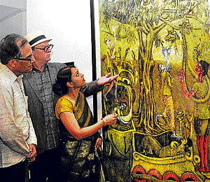 Collector Waswo (Centre), curator Lina Vincent Sunish and Sudhakar Rao, president of the advisory committee of the National Gallery of Modern Art (NGMA), take a look at a work at an exhibition of Indian Printmaking at the NGMA in the City on Saturday. DH Photo