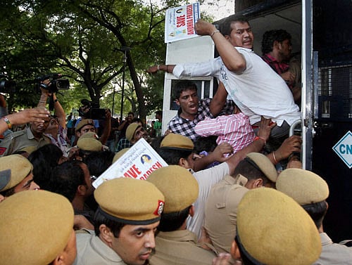 Police detain anti-Telangana activists who were protesting outside the Prime Minister's house against bifurcation of Andhra Pradesh, in New Delhi on Thursday. PTI