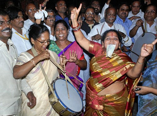 Celebrations broke out in Telangana region as the news of Lok Sabha passing the Andhra Pradesh Reorganisation Bill trickled in. File photo - PTI