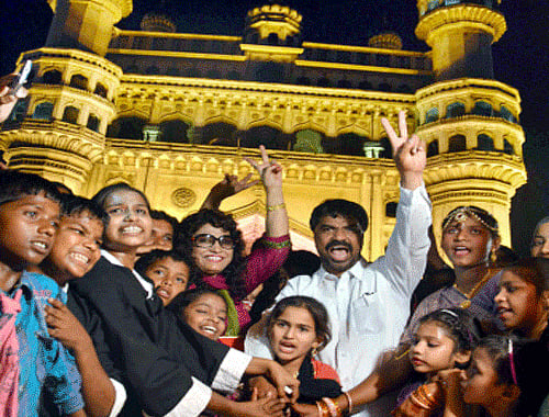 People celebrate Telangana formation day in front of Charminar on Sunday. PTI