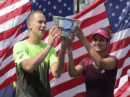 Left teary-eyed after her Indianness was put into question just weeks back, tennis star Sania Mirza dedicated her US Open title to the country and the new state of Telangana, where her appointment as brand ambassador triggered a political furore. Reuters photo