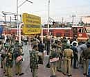 Police personnel stand next to the Hyderabad-Delhi Andhra Pradesh Express train, following rail roko agitations called by the Telangana Joint Action Committee (JAC) of students, at a railway station in Secunderabad on January 5, 2010. All political leaders from the state of Andhra Pradesh were called for a crucial meeting to be held in Delhi with Union minister P. Chidambaram on the contentious issue of Telangana. (AFP)