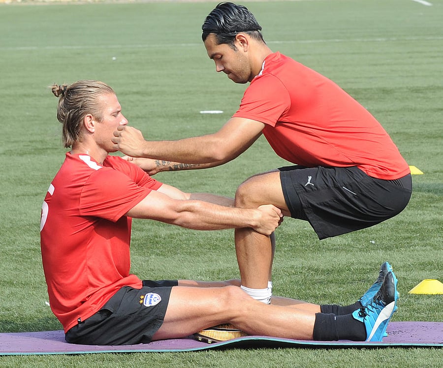 TWO TO TANGO BFC's Miku (right) goes through the paces along with Erik Paartalu during a practice session on Wednesday. DH Photo/ Srikanta Sharma R