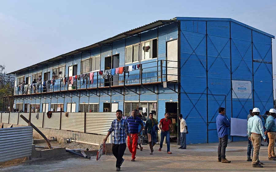 Members of the Karnataka Workers' Union staged a protest here on Wednesday, demanding Sobha Developers pay a compensation of Rs 25 lakh to the families of the labourers who died due to cholera at a construction site. DH file photo