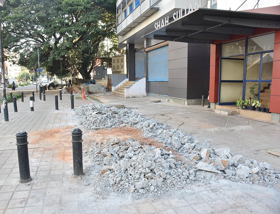 The damaged TenderSURE footpath in front of Shah Sultan complex on Cunningham Road. DH Photo