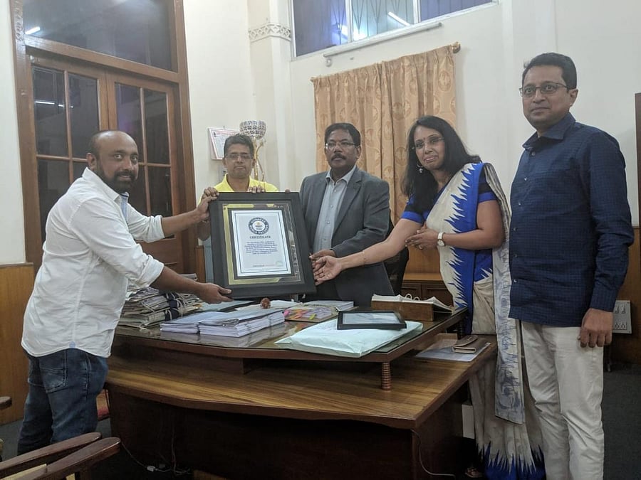 BBMP Commissioner N Manjunatha Prasad on Sunday receives the Guinness Book of World Records certificate for the most plastic bottles collected for recycling in 12 hours.
