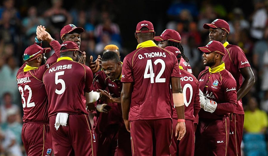 Sheldon Cottrell celebrates the dismissal of Moeen Ali during the 2nd ODI between West Indies and England at Kensington Oval, Bridgetown, Barbados. (AFP Photo)