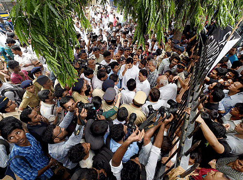 Campa Cola residents block the entrance for the BMC officials who arrived to disconnect the water and electricity supply of the society, in Mumbai on Friday. PTI Photo