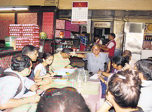 A viewof the Kyani and Co, located atMetro. Rafique Baghdadi with plates of chicken berry pulao and chicken salli. Bun-maska and tea at Kyani. Beer glasses at Cafe Military