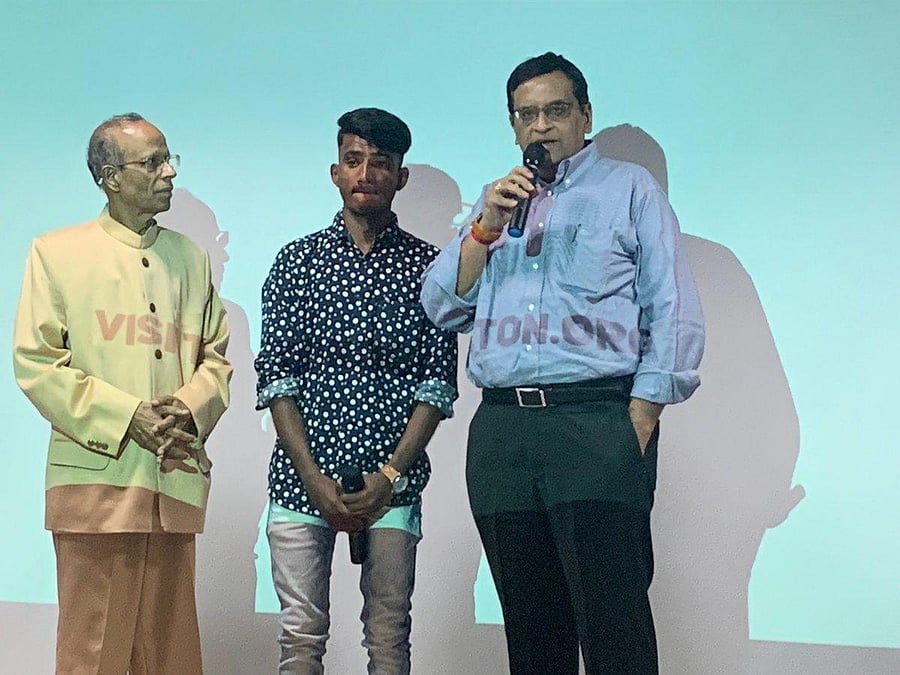Siddharameshwara Humanabade (Centre) being felicitated by Fire Champion award in Bengaluru by A Ravindra, former chief secretary (Right) and Uday Vijayan, Founder of Beyond carlton (left) on Saturday in Bengaluru.