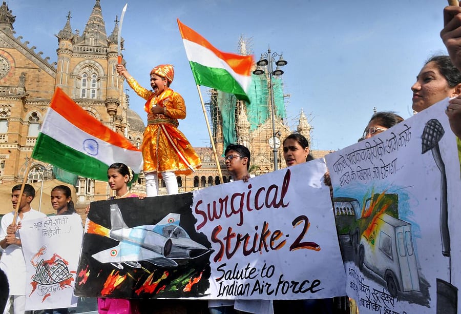 Students celebrate after Indian Air Force's major preemptive strike in Balakot on Jaish-e-Mohammed's camps, in Mumbai, on Feb. 26, 2019. PTI