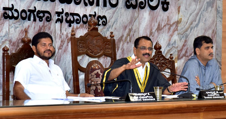 Mangaluru City Corporation Mayor Bhaskar K chairs the MCC general meeting on Thursday. Deputy Mayor Muhammed K and Commissioner B A Muhammed Nazir look on.
