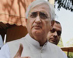 External Affairs Minister Salman Khurshid talking to media at Parliament house in New Delhi. PTI photo