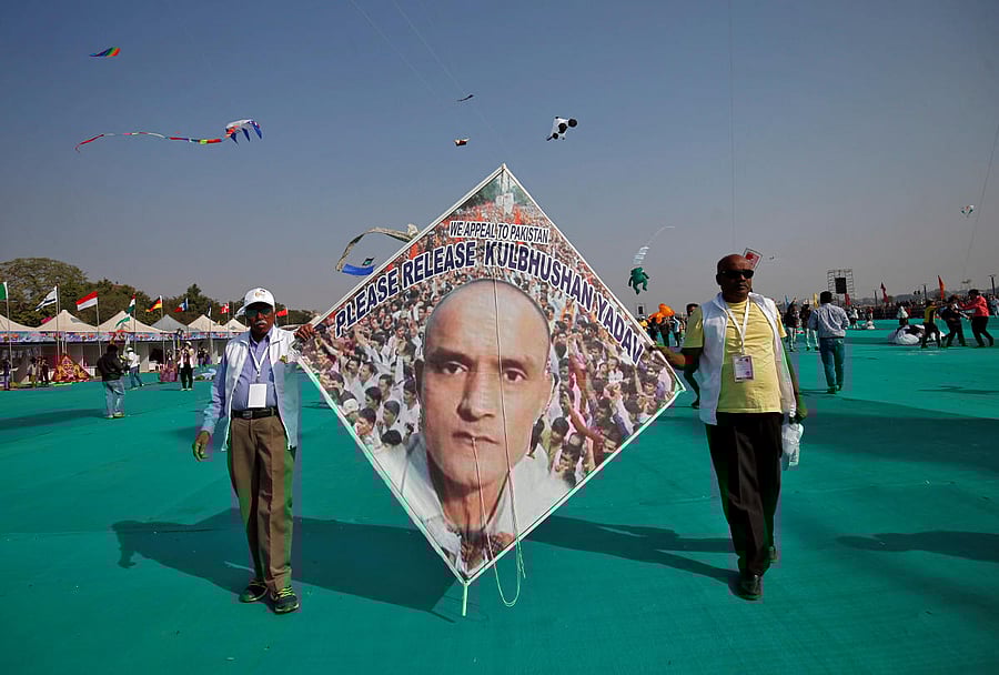 Kite-flying enthusiasts display a kite with an image of jailed Kulbhushan Sudhir Jadhav, a former officer in the Indian navy, who was arrested in the Pakistani province of Baluchistan, in Ahmedabad. REUTERS