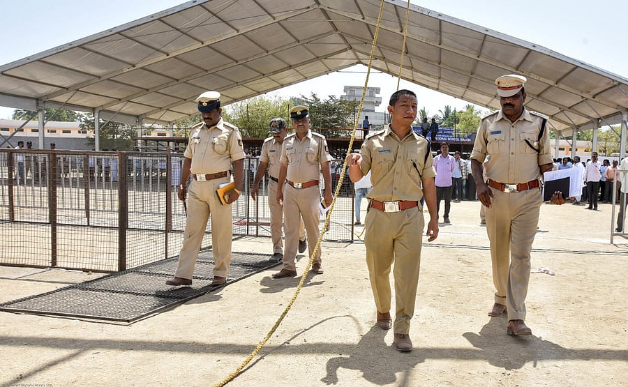 SP Iada Martin Marbaniang looks at the preparation works as prime minister narendra modi is going to address public rally at n v ground in kalaburagi on tuesday. - Photo/ Prashanth HG
