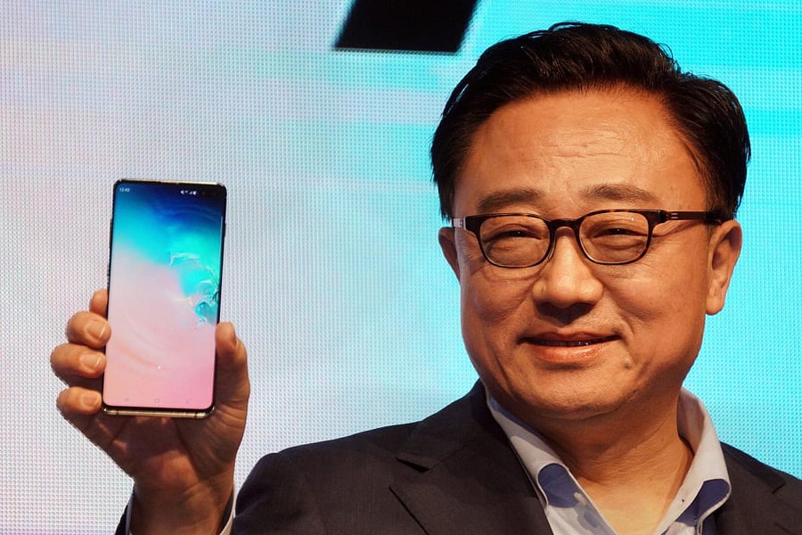 DJ Koh, president and CEO of IT & Mobile Communications Division, Samsung Electronics, launches the new Samsung Galaxy S10+ mobile phone, at a press conference in New Delhi on Wednesday. (PTI Photo)
