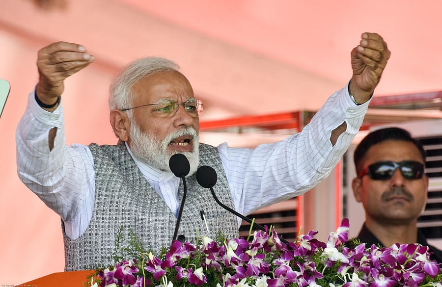 Prime Minister Narendra Modi gestures during his speech at a public rally for upcoming loksabha elections at NV Ground in kalaburagi on wednesday. - Photo/ Prashanth HG