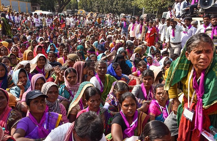 In this DH file photos, women from rural areas, who came from Chitradurga after a 12-day march, stage a protest on Sheshadri Road in Bengaluru demanding ban on the sale of liquor in the state.