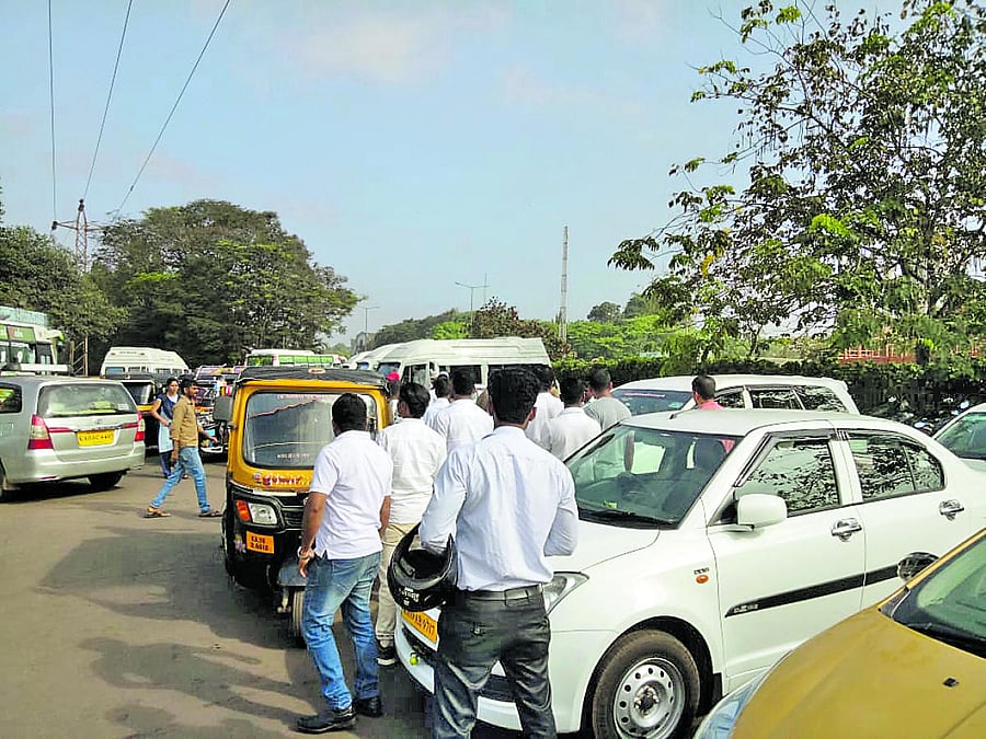 Taxi drivers are seen running towards two drivers who were raining blows on each other outside New Mangalore Port Gate recently.