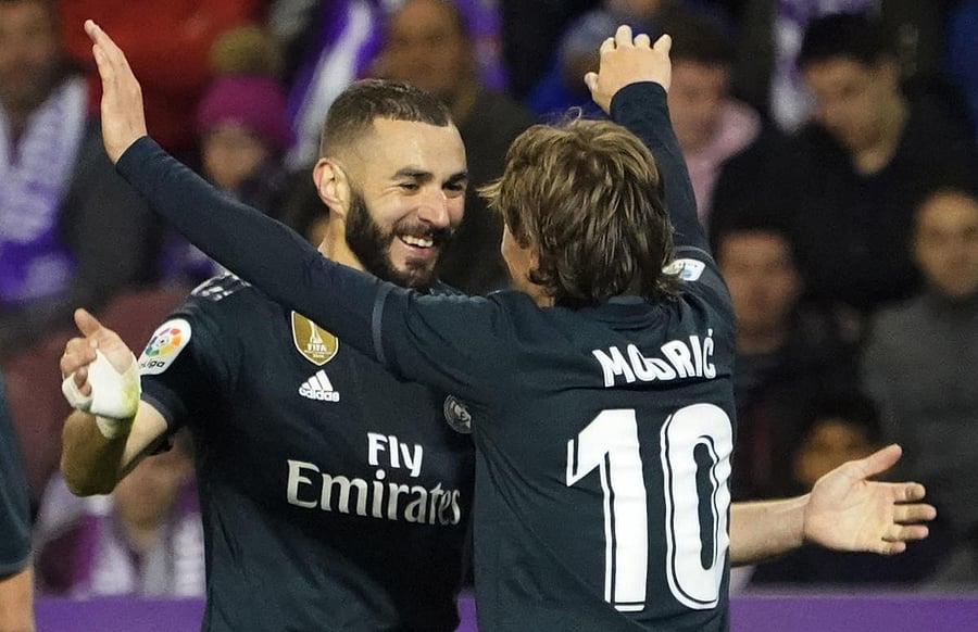 Karim Benzema (left) celebrates with Luka Modric after scoring against Real Valladolid in the La Liga on Sunday. AFP