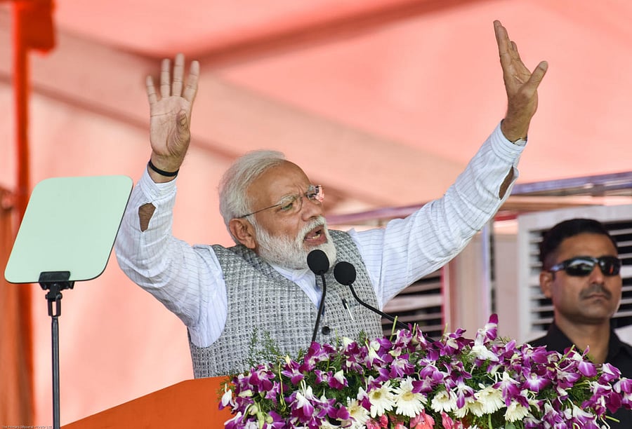 Prime Minister Narendra Modi gestures during his speech at a public rally for upcoming loksabha elections at NV Ground in Kalaburagi. - Photo/ Prashanth HG