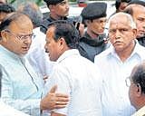 BJP leader Arun Jaitley speaks with MP D V Sadananda Gowda after a meeting at the CMs official residence in Bangalore on Friday. Rajnath Singh and B S Yeddyurappa look on. DH photo/ Anand Bakshi