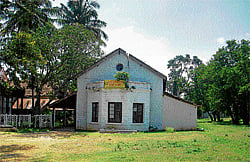 sepia-tinted memories KGF Gymkhana Club. (Below left) Deer and bison heads on the foyer wall. (Below right) Patrick and Heather Taylor in front of the photograph of his great grandfather John Taylor. (Photos by the author)