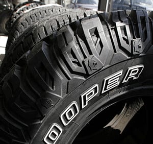 FILE - In this May 2, 2007 file photo, Cooper tires are on display at Vermont Tire and Service Inc. in Montpelier, Vt. India's Apollo Tyres Ltd. is buying Ohio's Cooper Tire & Rubber Co. for about $2.22 billion, boosting its presence in North America and other key markets around the world. Apollo said Wednesday, June 12, 2013, that the combined company will be one of the world's largest tire makers, with a strong presence across four continents and combined 2012 sales of $6.6 billion. Their tire brands include Apollo, Cooper, Roadmaster and Vredestein.AP Photo