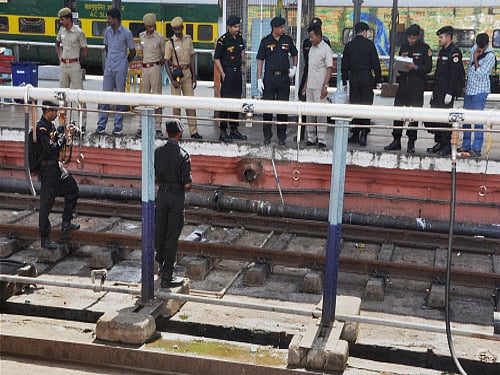 National Security Guard (NSG) commandos inspect the bomb-blast spot at the Central Railway Station in Chennai. A team from Tamil Nadu's Crime Branch Friday arrived in Bangalore city to look for leads in Thursday's twin bomb blasts in the Bangalore-Guwahati train. PTI Photo