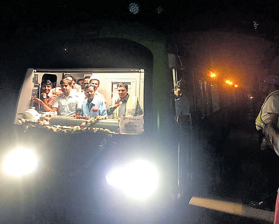 The battery-powered loco being brought from Peenya depot to National College Metro station on Saturday. DH Photo
