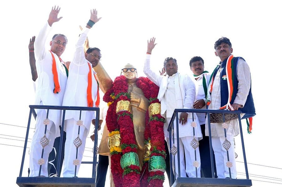 KPCC working president Dinesh Gundu Rao, president Dr G Parameshwara, MP K H Muniyappa, MLA Kotturu G Manjunath and Minister D K Shivakumar wave hands at the public after paying floral tributes to the statue of Dr B R Ambedkar in Mulbagal on Thursday. DH Photo