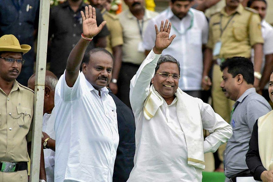Chief Minister H D Kumaraswamy and his predecessor Siddaramaiah. PTI file photo