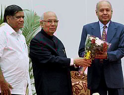 Karnataka Governor Hansraj Bhardwaj greets new Lokayukta, Justice Yarabati Bhaskar Rao as Karnataka CM Jagadish Shettar looks on during a swearing in ceremony at Rajbhavan in Bangalore on Thursday. PTI