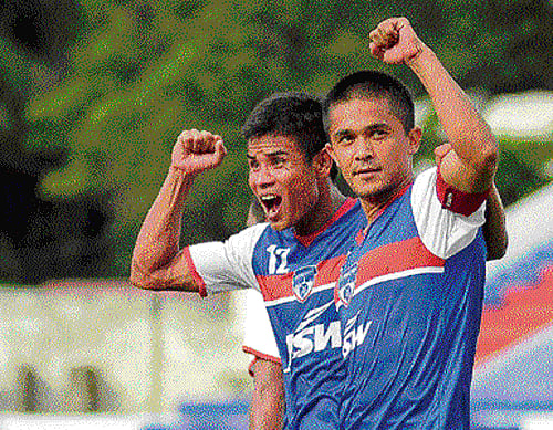 leading from the front: Bengaluru FC's Sunil Chhetri (right) celebrates with Thoi Singh after scoring against Shillong Lajong on Sunday. dh photo/ satish badiger