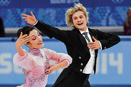 AWESOME TWOSOME: Meryl Davis (left) and Charlie White compete in the Ice dance figure skating event at Sochi on Sunday. AP
