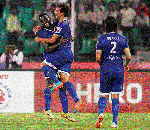 Chennaiyin FC's Elano (centre) celebrates his goal against Mumbai with team-mates John Mendoza and Jairo Suarez at Chennai on Tuesday.