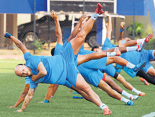 BFC' forward Sean Rooney and his team-mates sweat it out at the Bangalore Football Stadium on  Thursday ahead of their I-League match against Royal Wahingdoh. dh photo / kishor kumar bolar