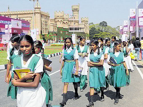 Students visit 'Invest Karnataka 2016 Global Investor Meet', at Palace Grounds in Bengaluru on Friday. DH PHOTO BY B H SHIVAKUMAR