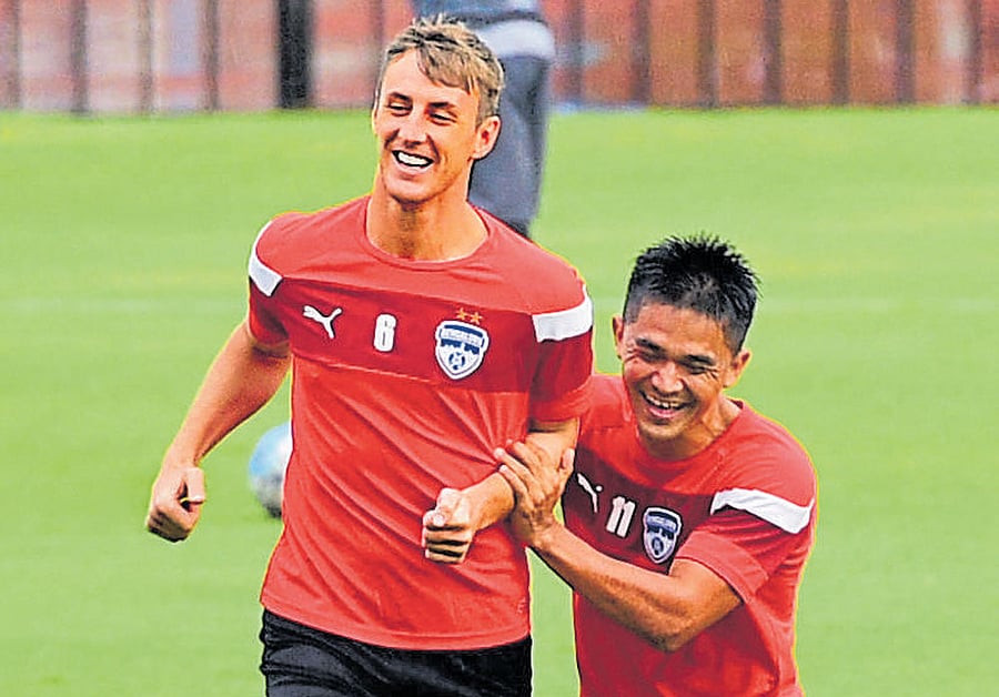 Bengaluru FC lynchpins John Johnson (left) and Sunil Chhetri share a joke during a training session on Monday. DH photo/ KRISHNAKUMAR PS