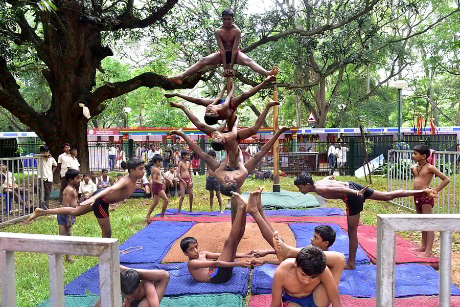 Children performing Malla Kambha at Makkala Habba 2017 in Cubbon Park on Saturday. Photo/ B H Shivakumar
