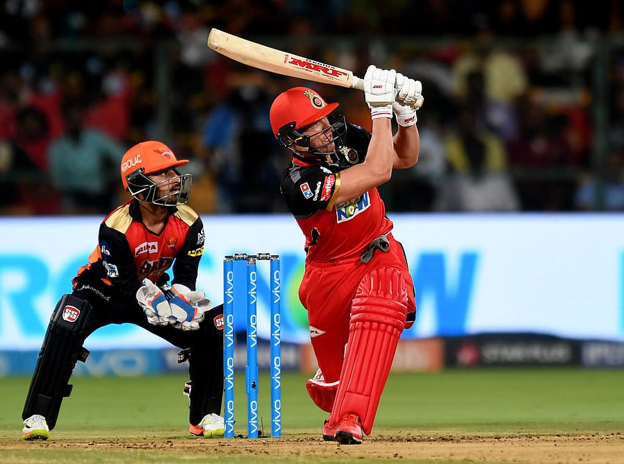 RCB's AB de Villiers whacks one to the boundary during his 69-run knock. DH PHOTO/ SRIKANTA SHARMA R 