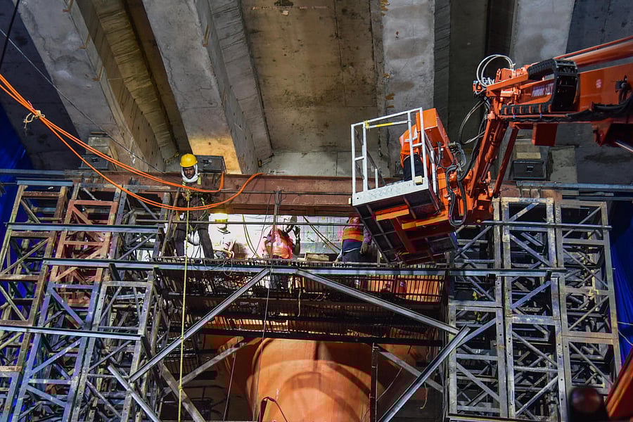 Workers repair the faulty Namma Metro pier near Trinity station began on Friday night. DH PHOTO/S K DINESH