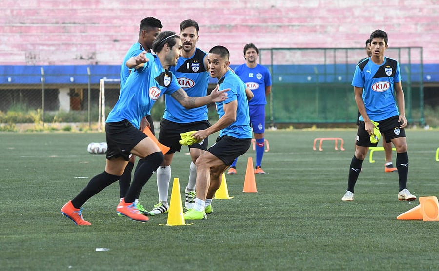 fun time: BFC players train at the Bangalore Football stadium on the eve of their clash against FC Goa. DH Photo/ B H Shivakumar
