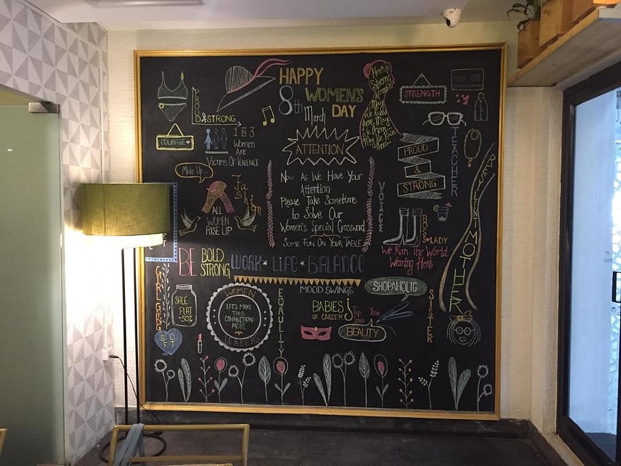 A blackboard at the entrance announces the theme for the month.