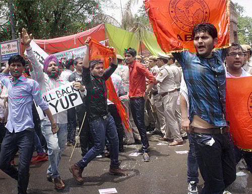 ABVP activists protest against the four-year undergraduate programme (FYUP) of Delhi University in New Delhi on Saturday. PTI Photo