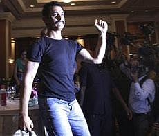 Bollywood actor Aamir Khan dances during a press conference to promote "Delhi Belly", a movie produced by him in Mumbai on Thursday. PTI