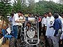 Minister for Higher Education Aravind Limbavali watching a car model at the Golden Jubilee Global Alumni Convention of the National Institute of Technology Karnataka (NITK) at Surathkal on Saturday.